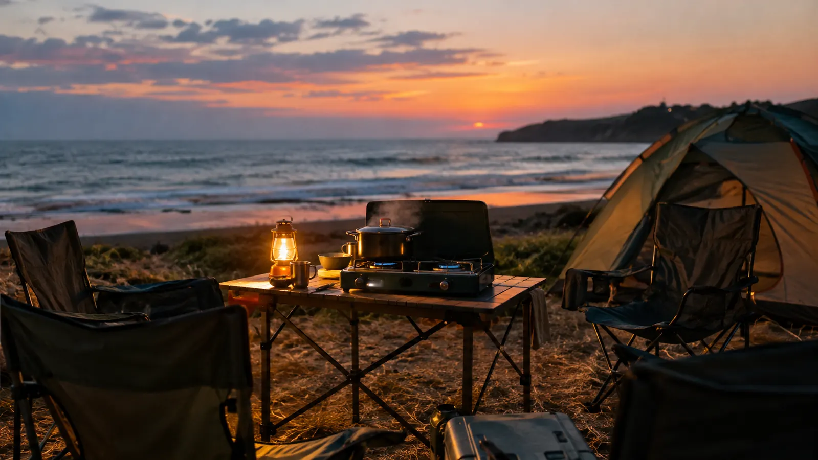 A campsite at dusk with a two-burner propane stove on a folding table, a lantern glowing, a pot of chili steaming, and camp chairs circled around